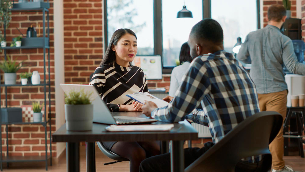 two employees talking