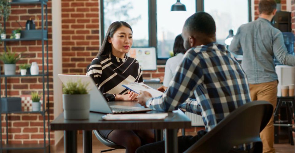 two employees talking